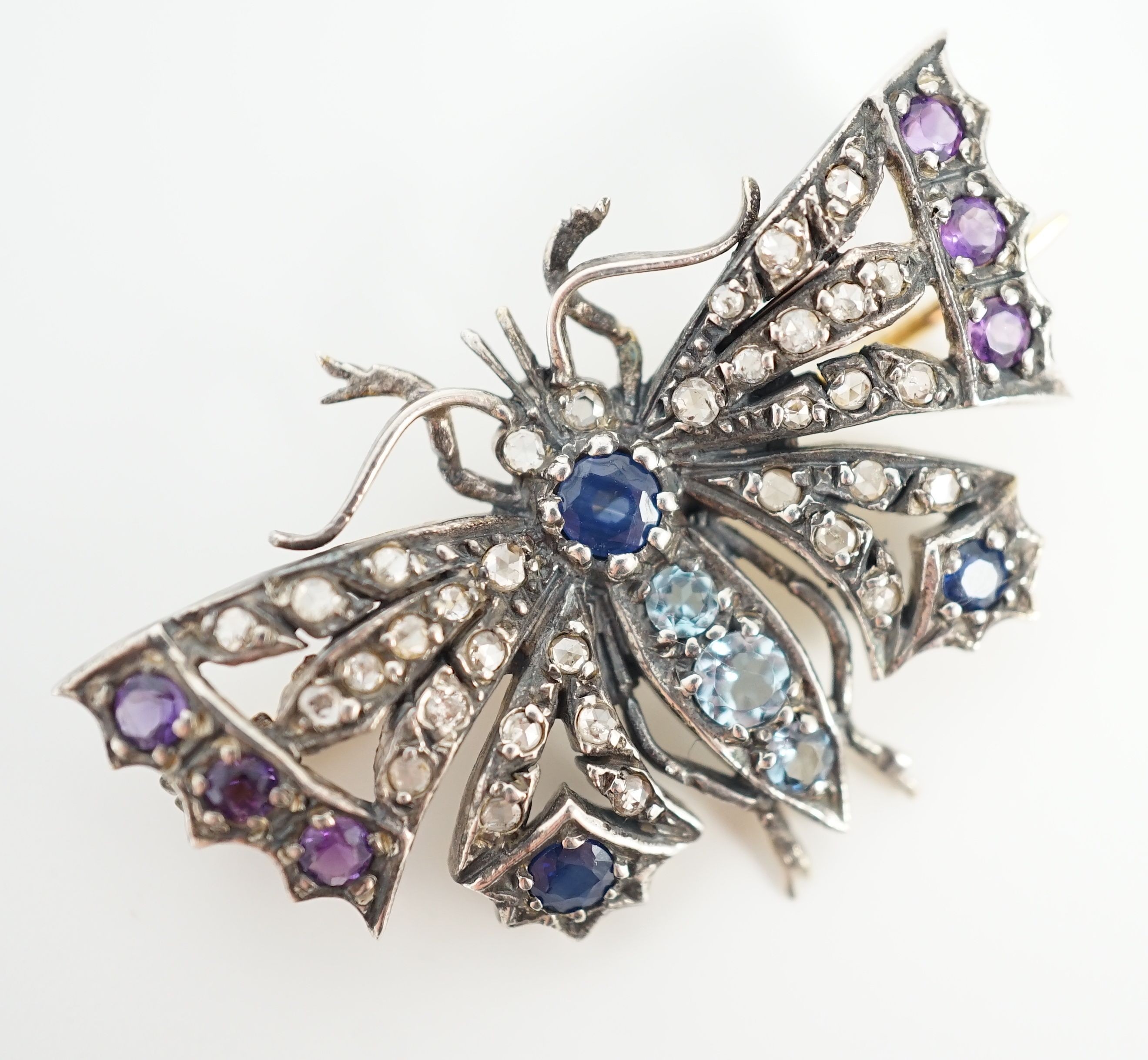 A Victorian gold and silver, diamond, amethyst, sapphire and aquamarine? set butterfly brooch